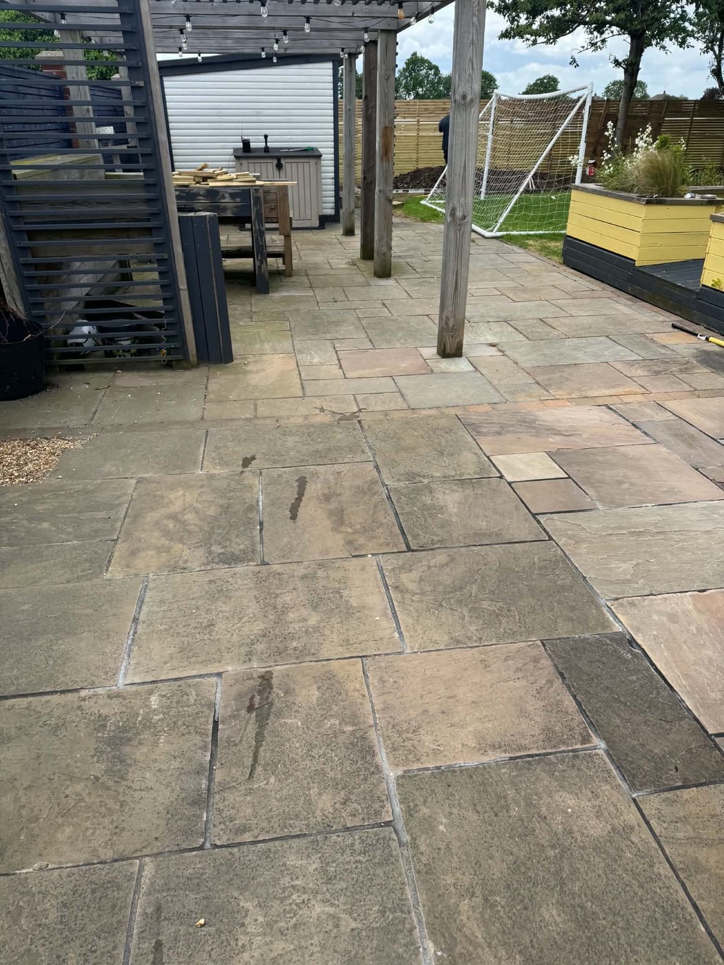 Before — the same patio dull and dirty